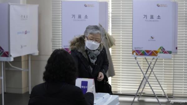 South Korea reports record 342,446 new COVID-19 cases as polls open